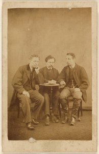 Three unidentified men, seated