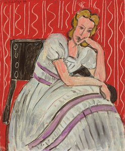 Young Woman Sitting in a Grey Dress