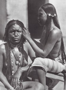 Sudanese women plaiting hair