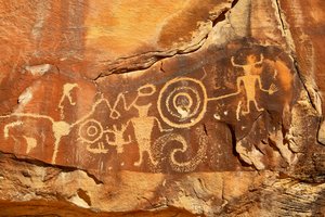 Near Vernal, UT at McKee Springs, Fremont petroglyphs showing warriors holding trophy heads., 2005 by Ira Block