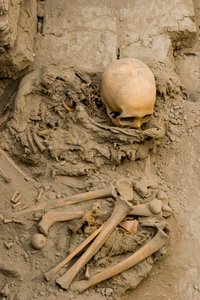 The sacrificial female in the burial with the mummy bundle at Huaca El Brujo by Ira Block