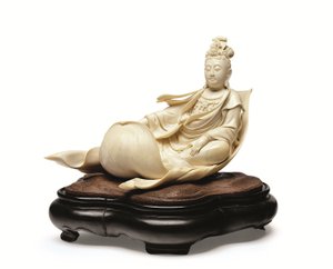 An ivory carving of Kannon floating on a lotus leaf, Meiji period, late 19th century by Ishikawa Komei