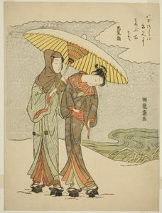 Young Couple Under an Umbrella in the Snow