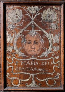 Wooden Plate Decorated with a Face and the Inscription 