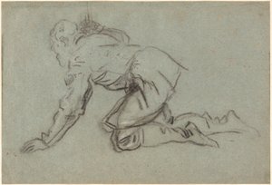 A Kneeling Man Holding a Staff