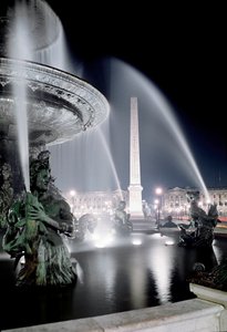 View of the fountain made by Jacques Ignace Hittorff and the obelisk of Place de la Concorde in Paris