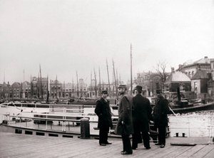 Men by a canal boat, Rotterdam by James Batkin