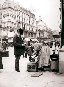Woman polishing shoes, Brussels