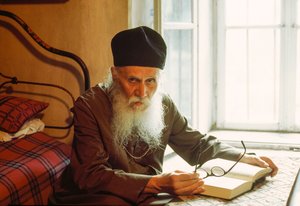 Portrait of an Eastern Orthodox Priest, Reading, Rila Monastery, Rila, Bulgaria by James L Stanfield