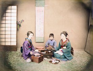 Two Women and a Child Have Lunch, Sitting on a Mat by Japanese Photographer