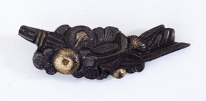 Menuki, or grip ornament, in the shape of a floral arrangement by Japanese School