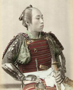 Portrait of a Samurai of Old Japan armed with full body armour, 1890