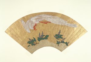 Bird diving onto snow-covered bamboo