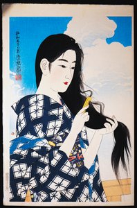 Young Woman Combing Her Hair