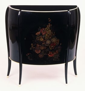 A bow-front chest of drawers by Jean Dunand
