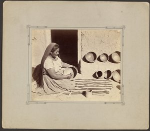 Woman Polishing Pottery by John K. Hillers