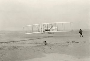 The Wright Flyer I makes its first flight of 120 feet in 12 seconds, at Kitty Hawk, North Carolina