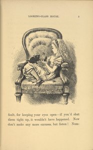 Alice sitting in a chair playing with a kitten