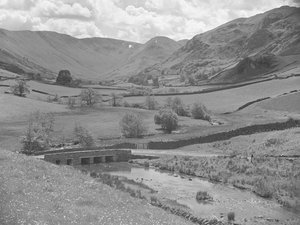 Bridge over a river surrounded by hills at Martindale by Joseph Hardman