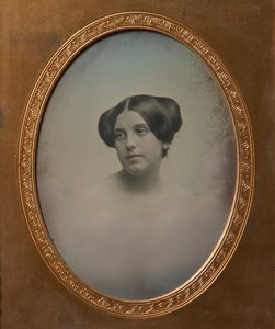 Young Woman with Hair Styled in Two Buns