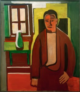 Man Standing by the Window