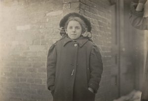 Mery Horn, a hunchback condition aggravated by the heavy load of papers she carried. Hartford, Connecticut, March 1909 by Lewis Hine