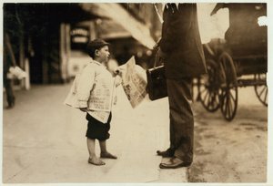 6 year old newsboy Hyman selling papers until 6 p.m. in Lawrence, Massachusetts, 1911 by Lewis Wickes Hine