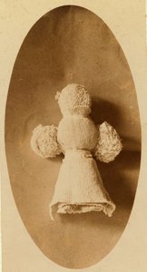A Doll Made from Waste Material by a Child in a Knitting Mill Where Mother Works