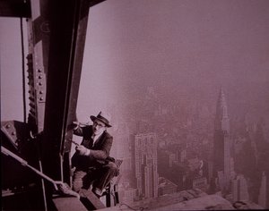 Empire State Building under construction, showing an inspector checking work