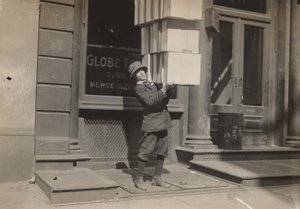 Wagon Boy or Tail Boy Helping to Load the Wagon by Lewis Wickes Hine