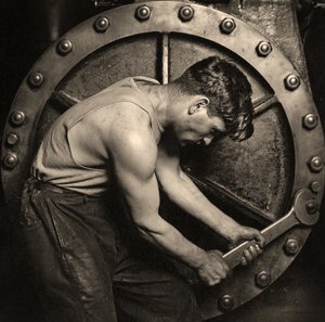 Close-up of a Power House Mechanic Working on Steam Pump c.1920
