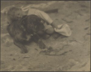 Boy Resting on Dog