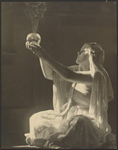 Costumed Woman Holding a Glass Incense Burner by Louis Fleckenstein