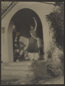 Female Dancer before House