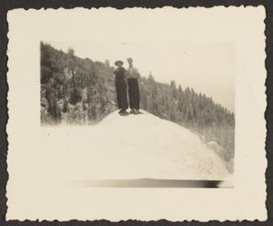 Figures Standing on Rock