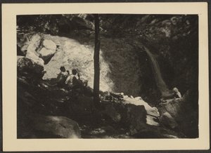 Figures in Shadowed Forest Landscape by Louis Fleckenstein