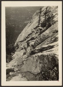 Hiker Climbing on Boulder by Louis Fleckenstein