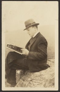 Man Reading Magazine on Rock by Louis Fleckenstein