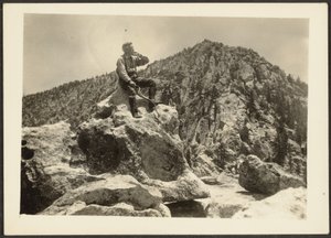 Man Seated on Rocks