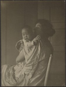 Mother Holding Baby in Chair