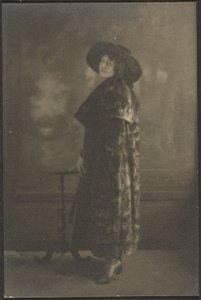 Portrait of Woman in Long Coat before Tapestry by Louis Fleckenstein