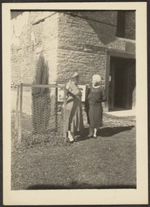 Two Women before Building