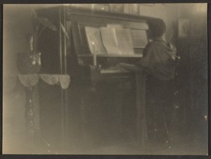 Woman Playing Piano by Louis Fleckenstein