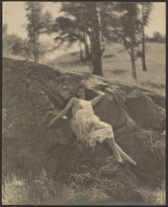 Woman Reclining on Rock Outcrop