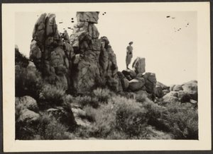 Woman Standing on Rocks by Louis Fleckenstein