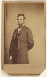 Abraham Lincoln standing with one arm behind his back by Mathew B. Brady