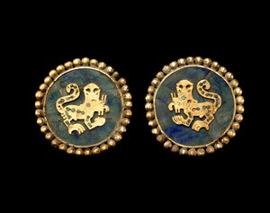 Pair of Ear Ornaments Depicting Supernatural Felines by Moche Moche