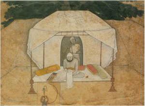 Balwant Singh Seated Writing on a Camp-Bed