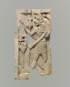 Furniture plaque carved in relief with lion-headed figure by Neo Assyrian