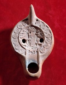 Paleochristian art: oil lamp medallion with a triumphant Christ